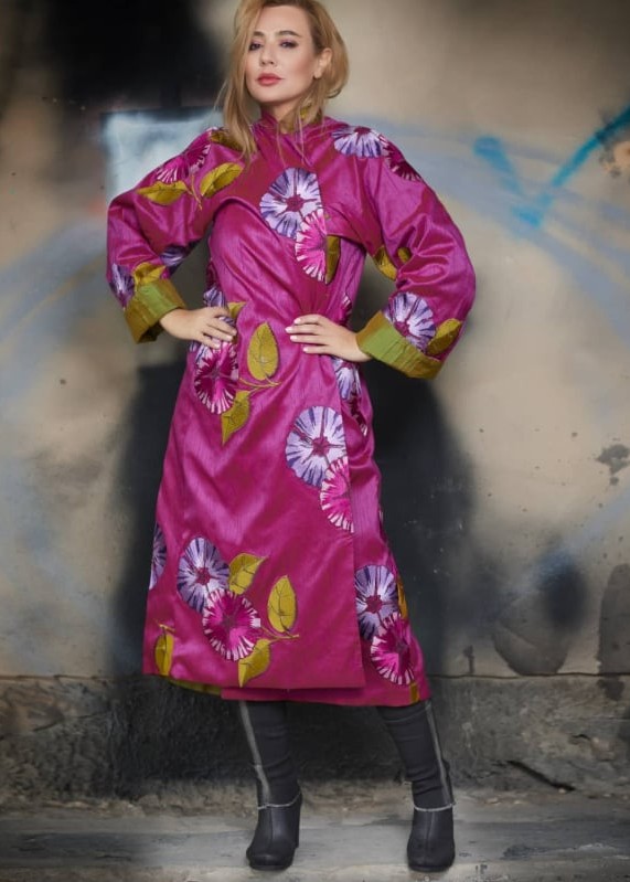 Roula Harb — Magenta Anemone Coat, hands on hips