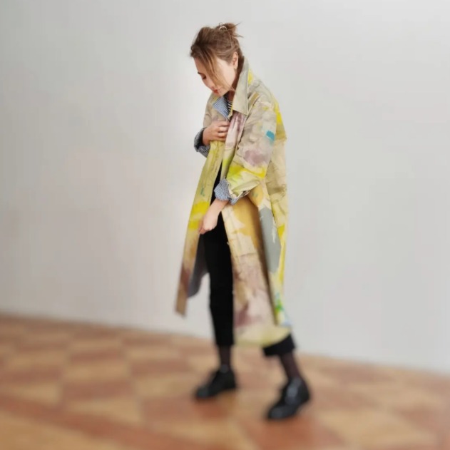 Roula Harb — Yellow and sage painted coat, studio